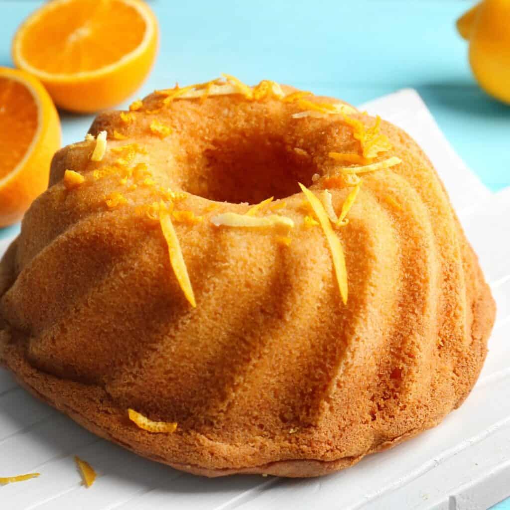 orange bundt cake with orange zest on top