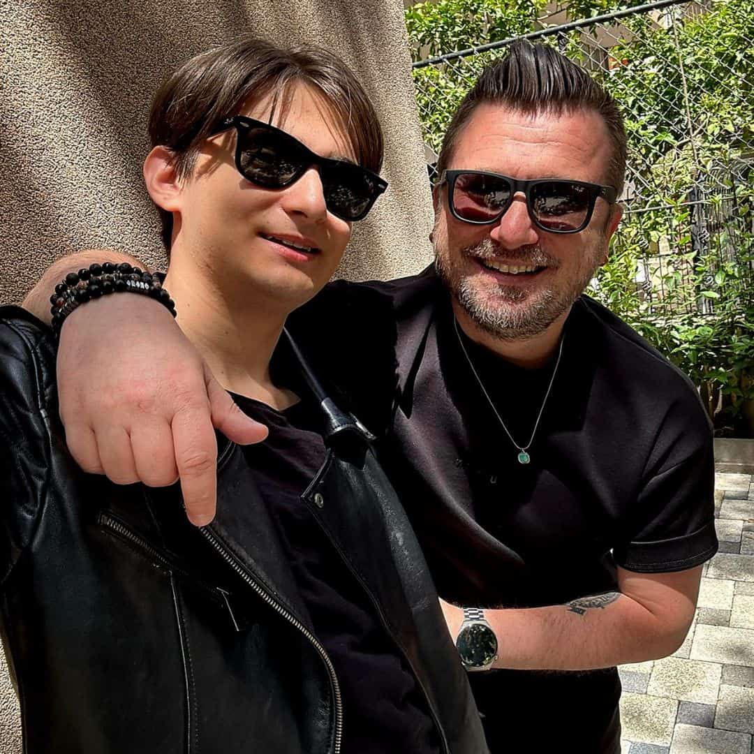 Marcus and his son dressed in all black