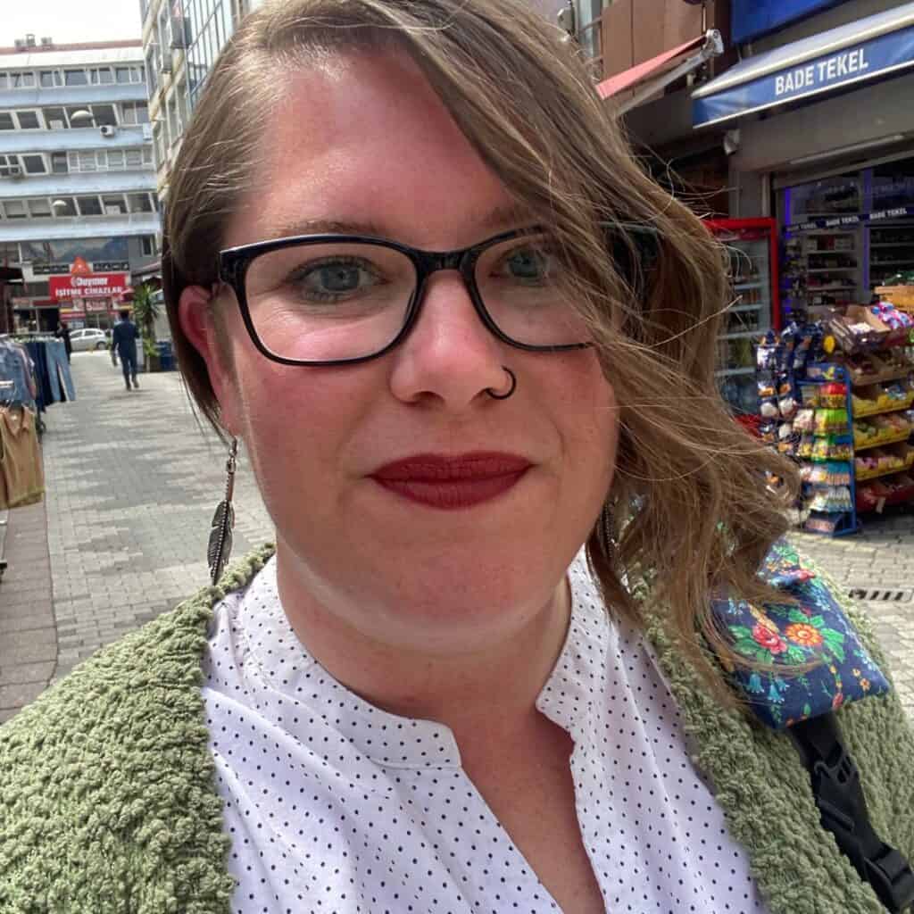 Kimberly on the streets of Kadıköy in Istanbul with a tekel in the background